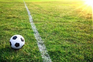 6996262-un-pallone-da-calcio-o-il-calcio-nello-stadio-con-tramonto-2